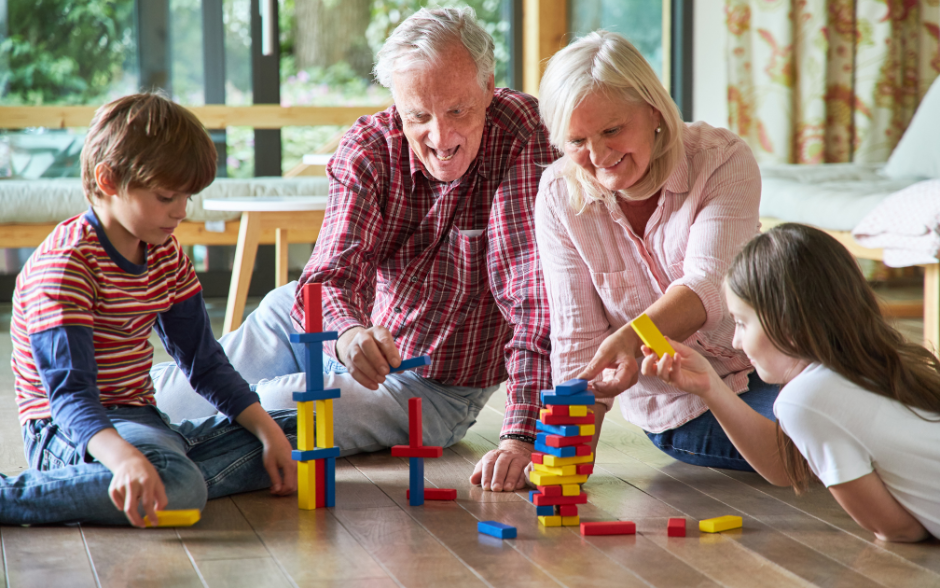 grandparents suffering from hip pain while playing with grandchildren